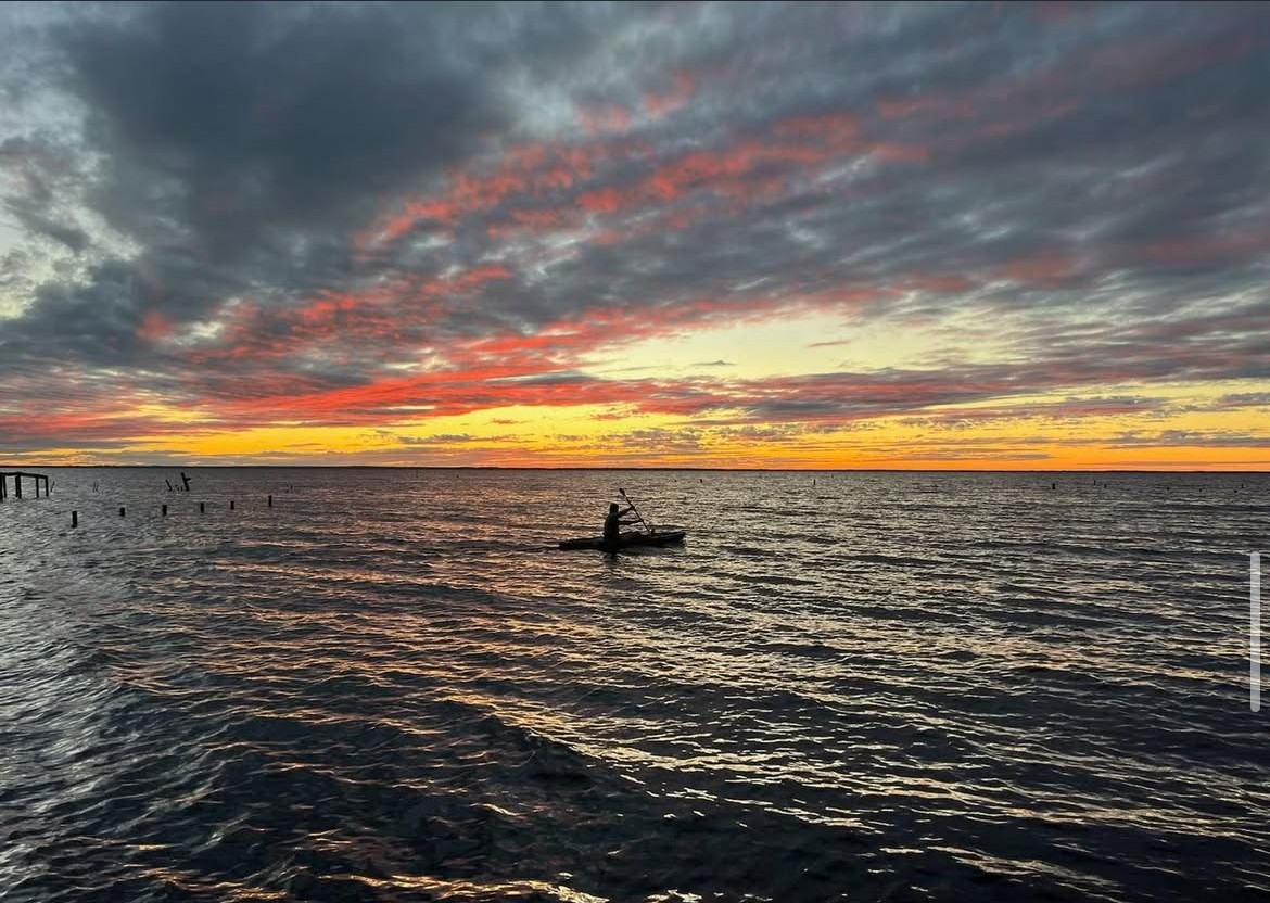 Kayaker on Lake George at sunset