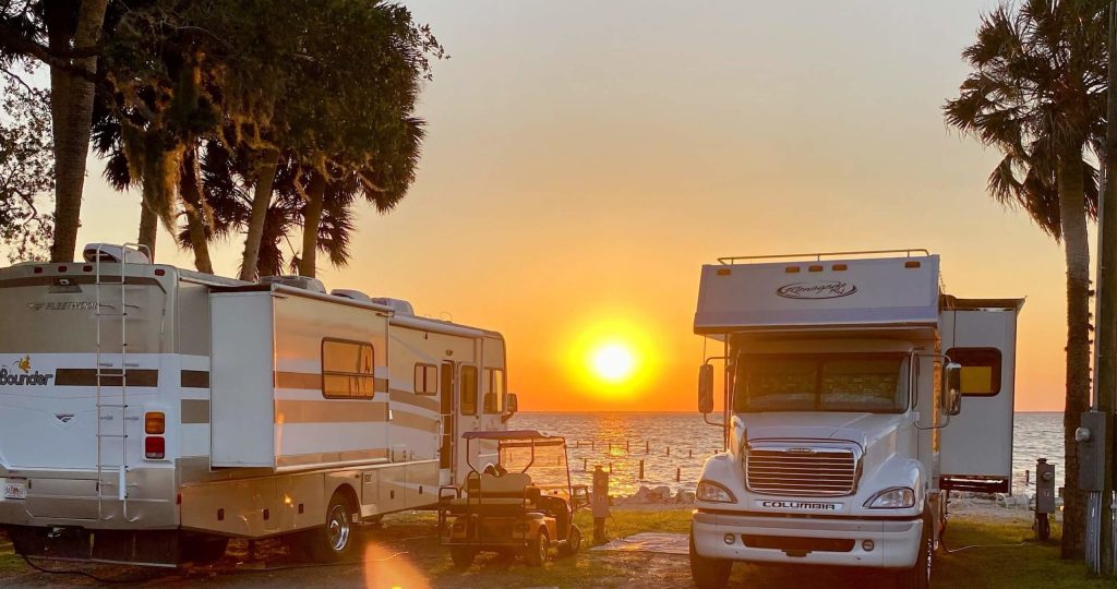 Long-term RV site with mature trees and lake access